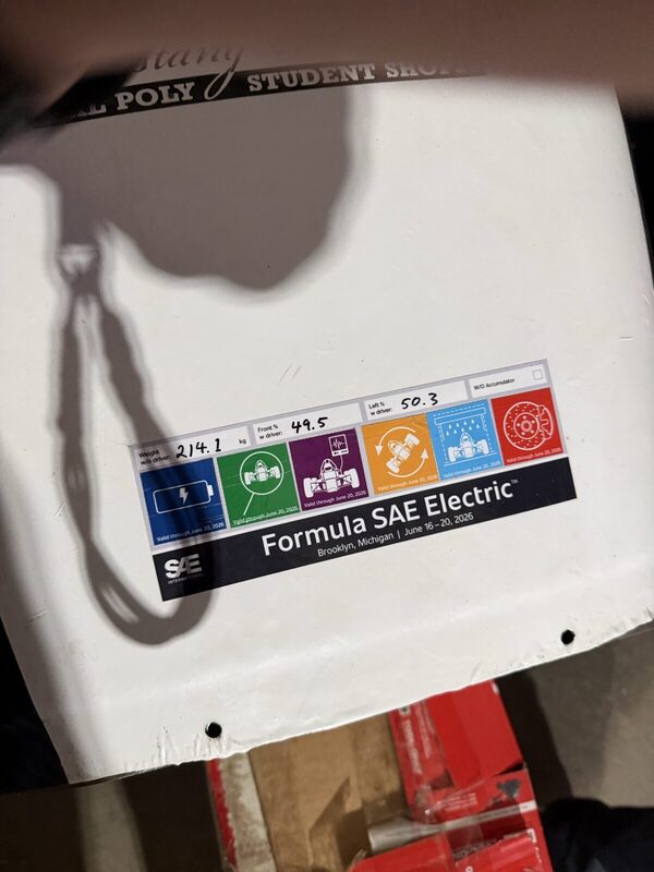 Formula SAE Electric 2026 technical inspection sticker on the white nose of the car.